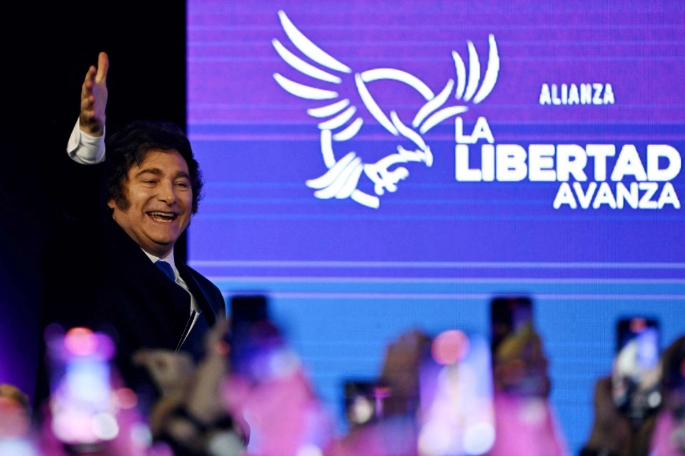 Argentine President Javier Milei waves to supporters following a national midterm legislative election on Sunday. Argentine President Javier Milei waves to supporters following a national midterm legislative election on Sunday.