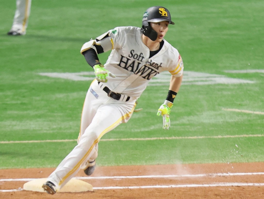 SoftBank's Ukyo Shuto rounds first base after hitting a double in the seventh inning at Mizuho PayPay Dome Fukuoka on Sunday. SoftBank's Ukyo Shuto rounds first base after hitting a double in the seventh inning at Mizuho PayPay Dome Fukuoka on Sunday.