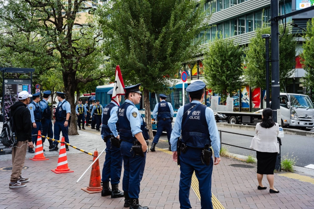 Police officers in Tokyo's Minato Ward on Monday. As many as 18,000 police officers are being mobilized to secure central Tokyo for U.S. President Donald Trump’s three-day visit to Japan. Police officers in Tokyo's Minato Ward on Monday. As many as 18,000 police officers are being mobilized to secure central Tokyo for U.S. President Donald Trump’s three-day visit to Japan.