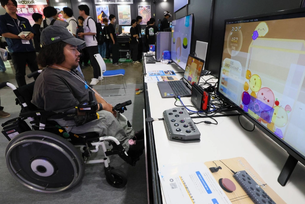 A player uses eye movement to play a game during the Tokyo Game Show held in the city of Chiba in September. A player uses eye movement to play a game during the Tokyo Game Show held in the city of Chiba in September.