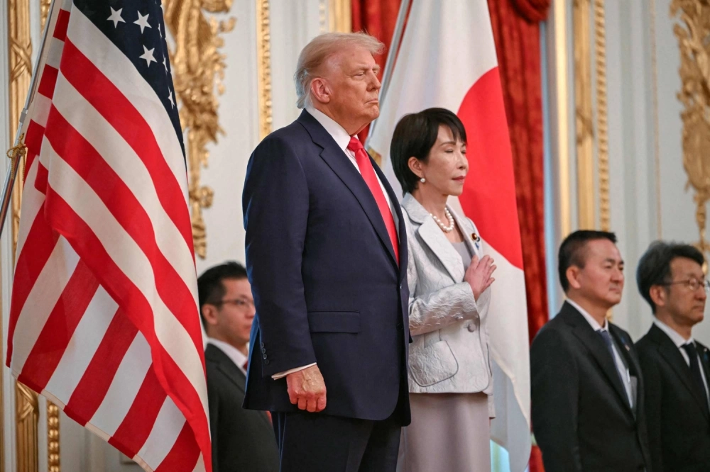 Prime Minister Sanae Takaichi and U.S. President Donald Trump review an honor guard at the Akasaka Palace in Tokyo on Tuesday. Prime Minister Sanae Takaichi and U.S. President Donald Trump review an honor guard at the Akasaka Palace in Tokyo on Tuesday.