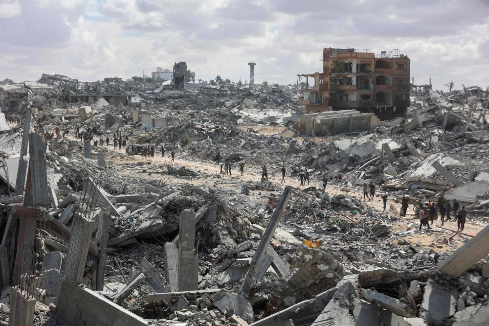 Khan Younis in the southern Gaza Strip on Oct. 12. Potentially as many as 10,000 Palestinians are unaccounted for and presumed dead, but in the devastation left by two years of war, with entire districts bombed or bulldozed into rubble, no one knows for sure.  Khan Younis in the southern Gaza Strip on Oct. 12. Potentially as many as 10,000 Palestinians are unaccounted for and presumed dead, but in the devastation left by two years of war, with entire districts bombed or bulldozed into rubble, no one knows for sure.