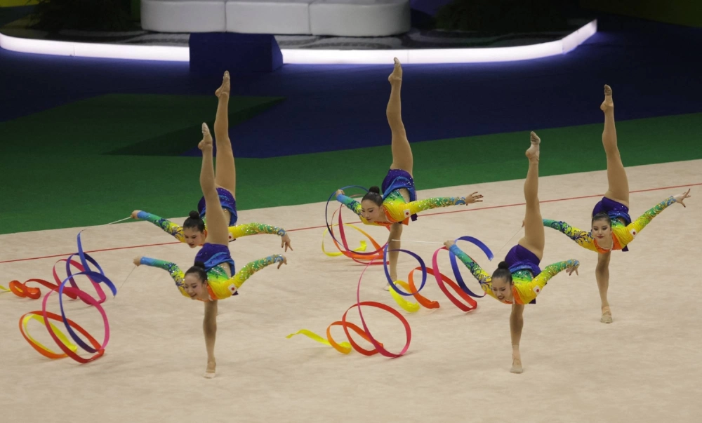 Team Japan performs during the group 5 Ribbons Final at the Rhythmic Gymnastics World Championships in Rio de Janeiro on Aug. 24.  Team Japan performs during the group 5 Ribbons Final at the Rhythmic Gymnastics World Championships in Rio de Janeiro on Aug. 24.