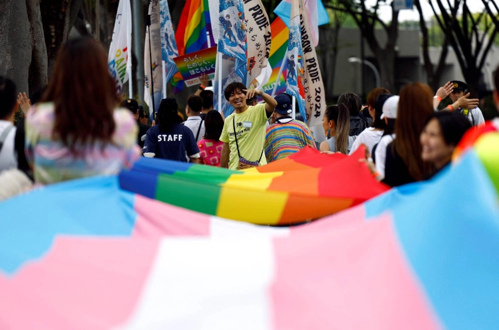 Participants march through Tokyo for the Tokyo Rainbow Pride parade in April last year. Participants march through Tokyo for the Tokyo Rainbow Pride parade in April last year.