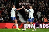 England defender Lucy Bronze (right) celebrates scoring the team's second goal during the match against Australia at Pride Park Stadium in Derby,  England on Tuesday. | AFP-JIJI