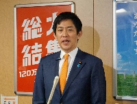 Liberal Democratic Party policy chief Takayuki Kobayashi speaks to reporters at the party's headquarters in Tokyo on Wednesday. | JIJI