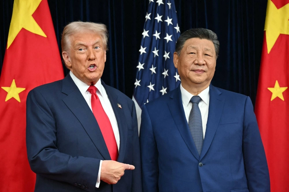 U.S. President Donald Trump and Chinese leader Xi Jinping greet each other as they arrive for talks at the Gimhae Air Base, next to the Gimhae International Airport in Busan, South Korea, on Thursday. U.S. President Donald Trump and Chinese leader Xi Jinping greet each other as they arrive for talks at the Gimhae Air Base, next to the Gimhae International Airport in Busan, South Korea, on Thursday.