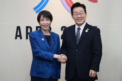 Prime Minister Sanae Takaichi shakes hands with South Korean President Lee Jae Myung ahead of their talks at the Asia-Pacific Economic Cooperation forum summit in Gyeongju, South Korea, on Thursday.  Prime Minister Sanae Takaichi shakes hands with South Korean President Lee Jae Myung ahead of their talks at the Asia-Pacific Economic Cooperation forum summit in Gyeongju, South Korea, on Thursday.