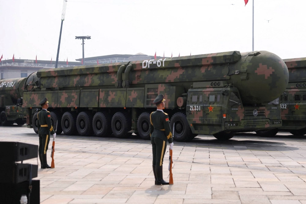 Members of the Chinese People's Liberation Army stand as the strategic strike group displays DF-61 nuclear-capable intercontinental ballisitic missiles during a military parade to mark the 80th anniversary of the end of World War II, in Beijing on Sept. 3. Members of the Chinese People's Liberation Army stand as the strategic strike group displays DF-61 nuclear-capable intercontinental ballisitic missiles during a military parade to mark the 80th anniversary of the end of World War II, in Beijing on Sept. 3.