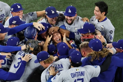 Dodgers pitcher Yoshinobu Yamamoto and teammates celebrate after winning the World Series against the Blue Jays. Yamamoto was named MVP for the series.  Dodgers pitcher Yoshinobu Yamamoto and teammates celebrate after winning the World Series against the Blue Jays. Yamamoto was named MVP for the series.
