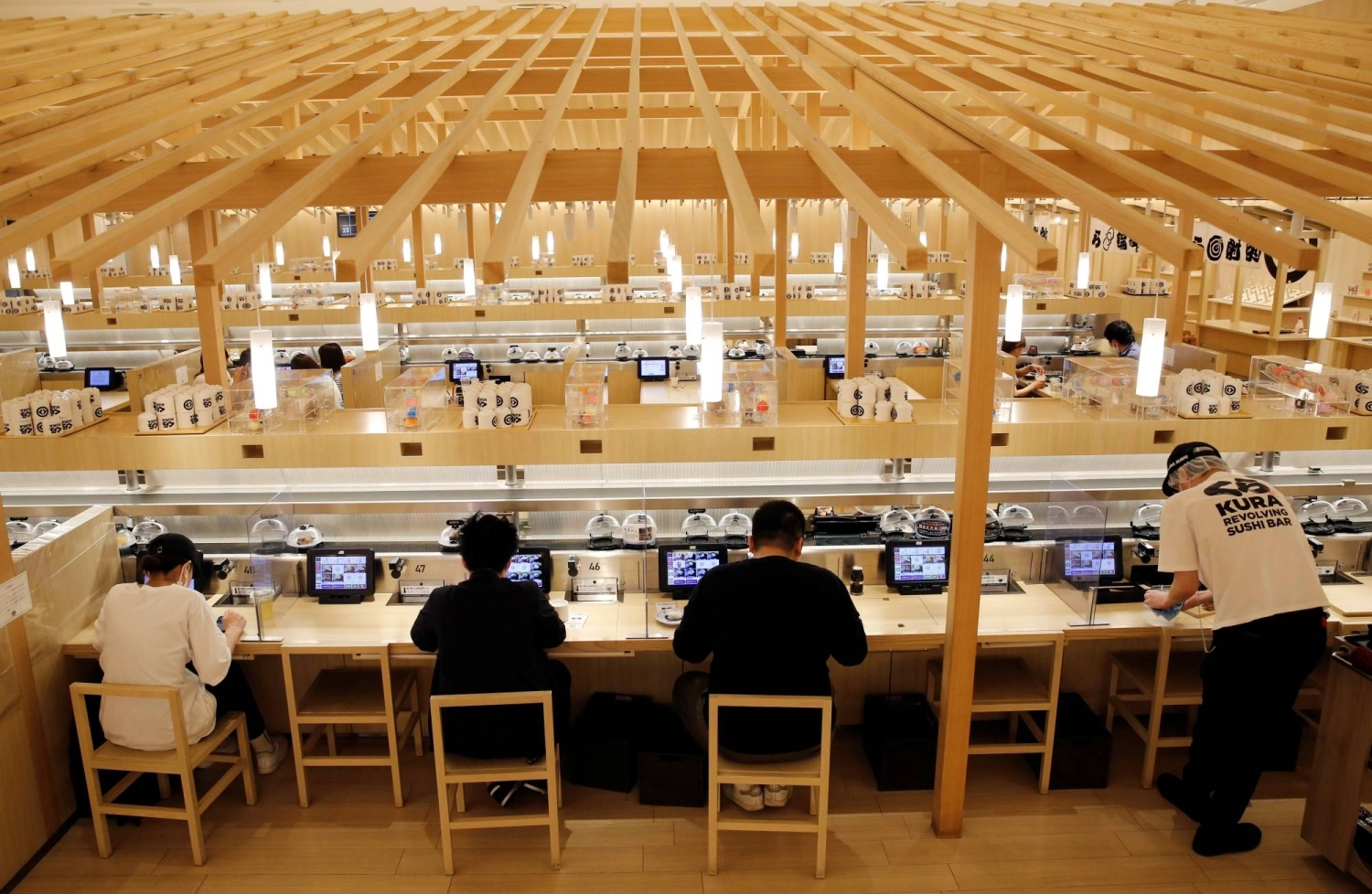 A Kura Sushi outlet in Tokyo in June 2021. As climate change affects the fisheries industry, the major sushi chain has implemented a lengthy list of policies to adapt and preserve their supply of fresh fish. A Kura Sushi outlet in Tokyo in June 2021. As climate change affects the fisheries industry, the major sushi chain has implemented a lengthy list of policies to adapt and preserve their supply of fresh fish.