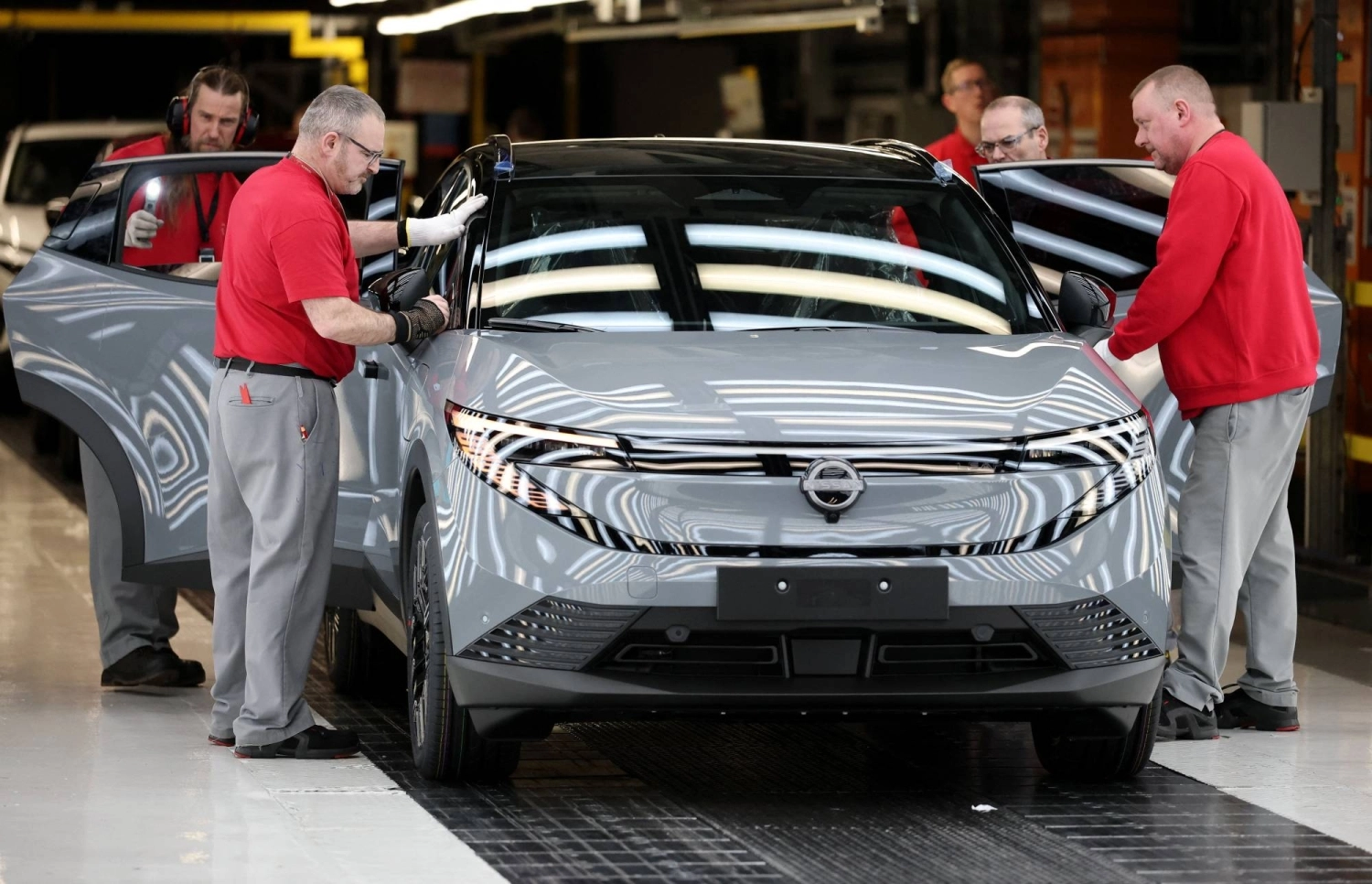 Workers inspect a Nissan Leaf electric car as it comes off the production line at a factory in Sunderland, England, in December. Workers inspect a Nissan Leaf electric car as it comes off the production line at a factory in Sunderland, England, in December.