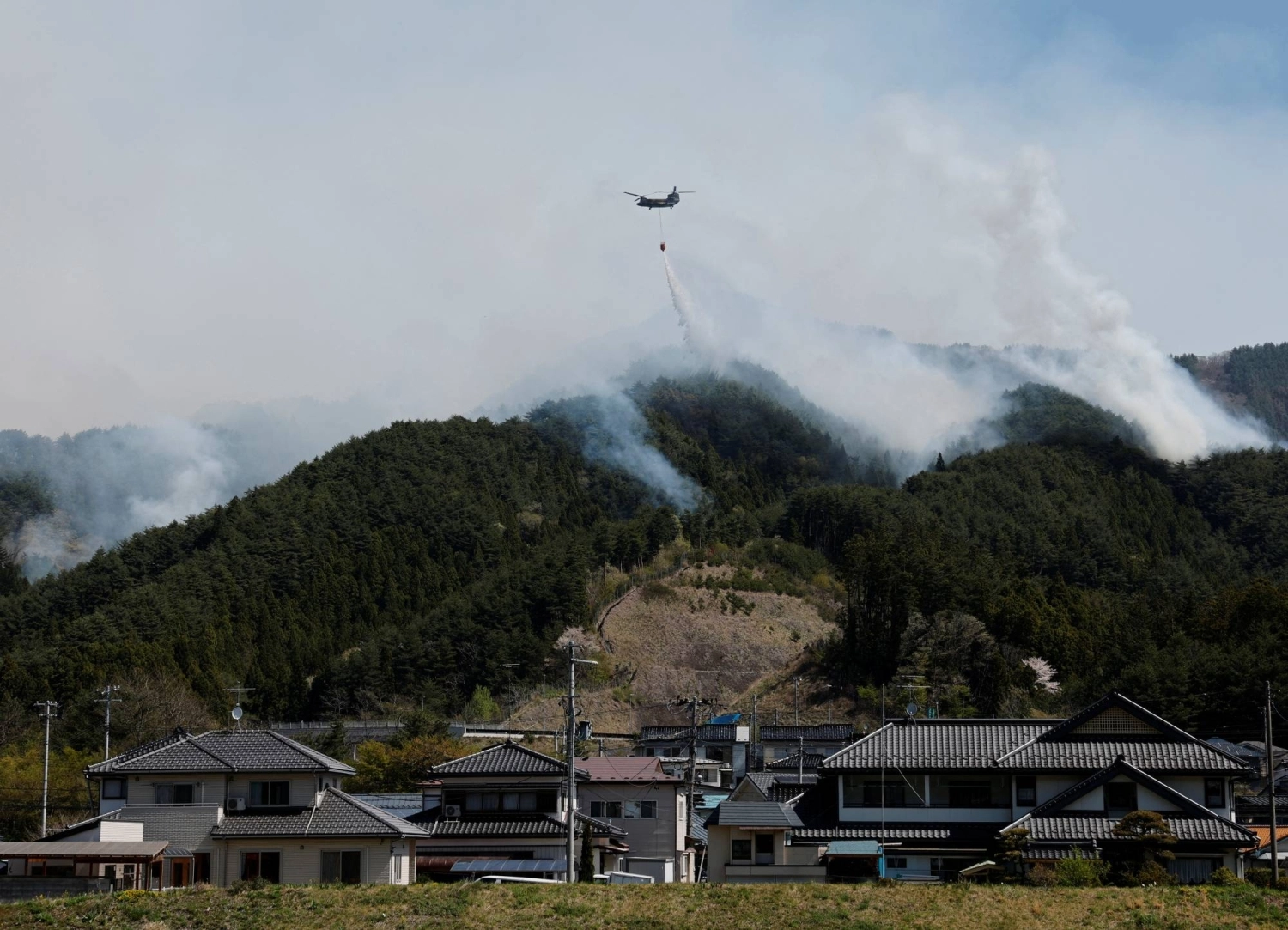 Crews battle wildfires in Otsuchi, Iwate Prefecture, on April 26. Crews battle wildfires in Otsuchi, Iwate Prefecture, on April 26.