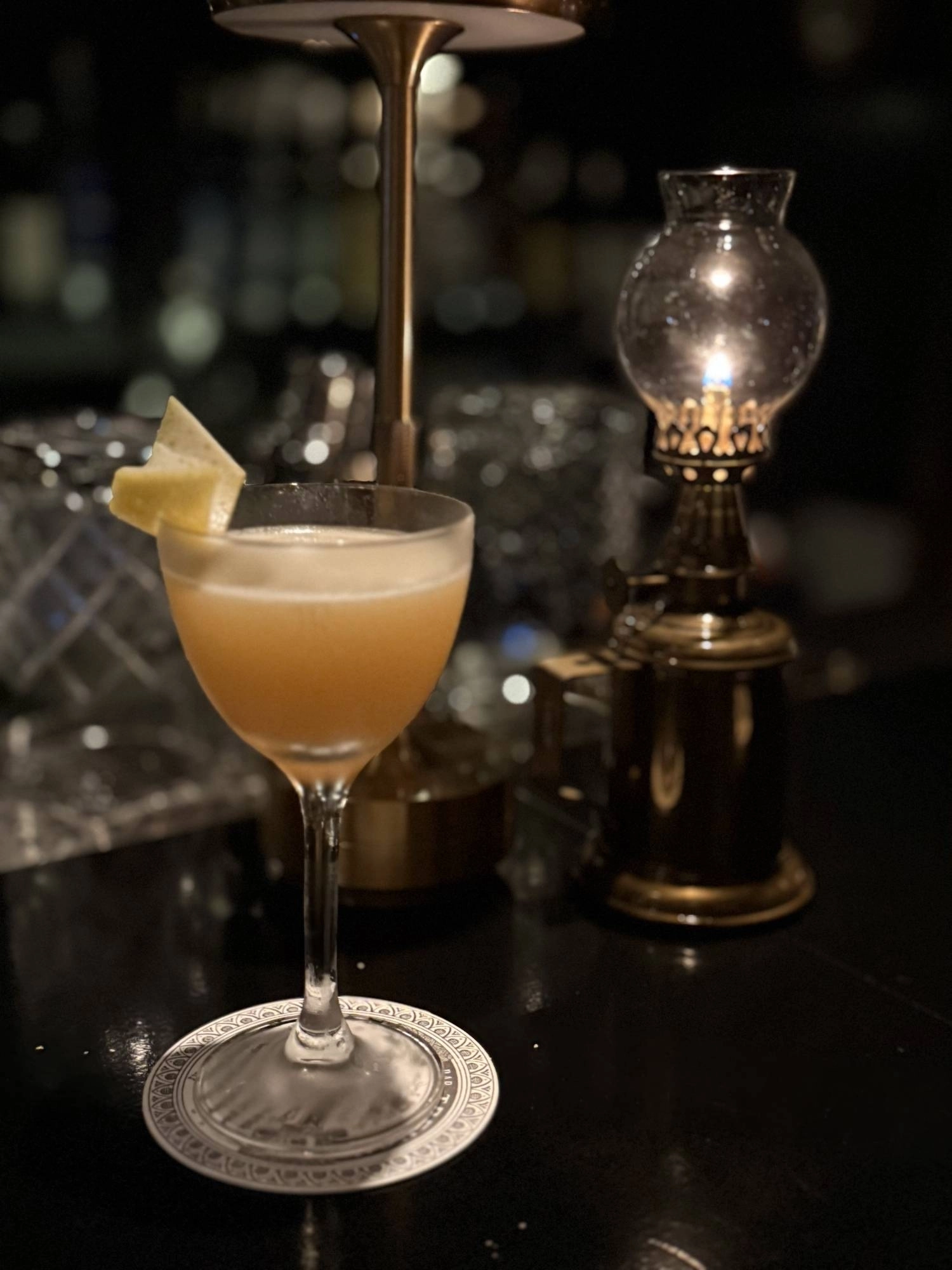 The Tender Talk cocktail at Bar Trench Kyoto is a blend of yuzu and lemon with a spritz of Laphroaig over a base of mezcal and Amaro Montenegro. The Tender Talk cocktail at Bar Trench Kyoto is a blend of yuzu and lemon with a spritz of Laphroaig over a base of mezcal and Amaro Montenegro.