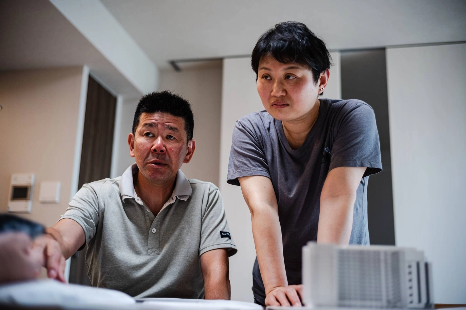 Munekazu and Erin Tanikawa in their condo in Inzai on May 27. The couple knew that something would be eventually built on the parking lot next to the condo, but assumed it would be something like a community center or a supermarket. Munekazu and Erin Tanikawa in their condo in Inzai on May 27. The couple knew that something would be eventually built on the parking lot next to the condo, but assumed it would be something like a community center or a supermarket.