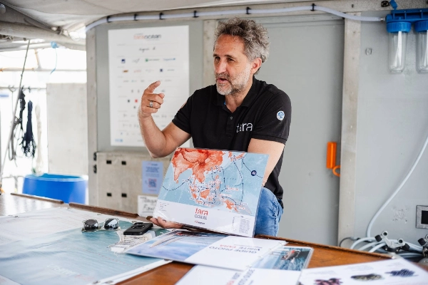 Image 22: Romain Troublé, the executive director of Tara Ocean Foundation, speaks to visitors aboard the Tara during a rare port call in Tokyo in April.