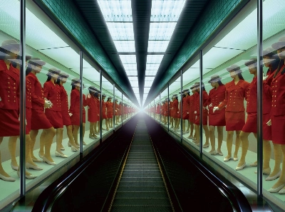 Miwa Yanagi’s “Elevator Girl House” series skewers the superficiality of gender roles through staged images.