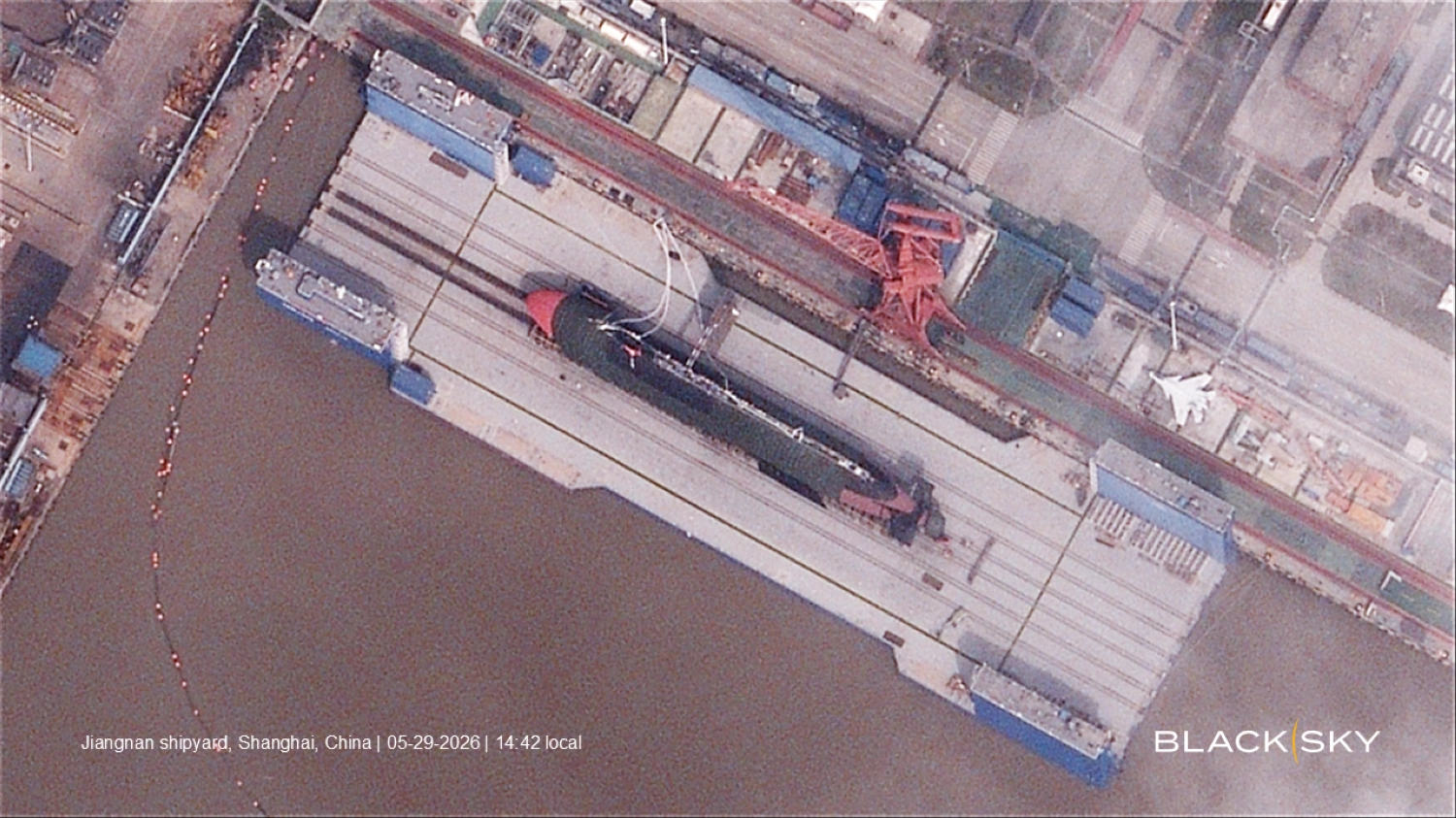 A new type of Chinese submarine is seen in images taken May 29 at Jiangnan Shipyard in Shanghai and provided to The Japan Times by U.S. satellite company BlackSky. The mystery sub features a dramatically smaller sail and larger dimensions — approximately 120 meters long and 10 meters wide — than China’s Type 093 nuclear-powered attack submarine.