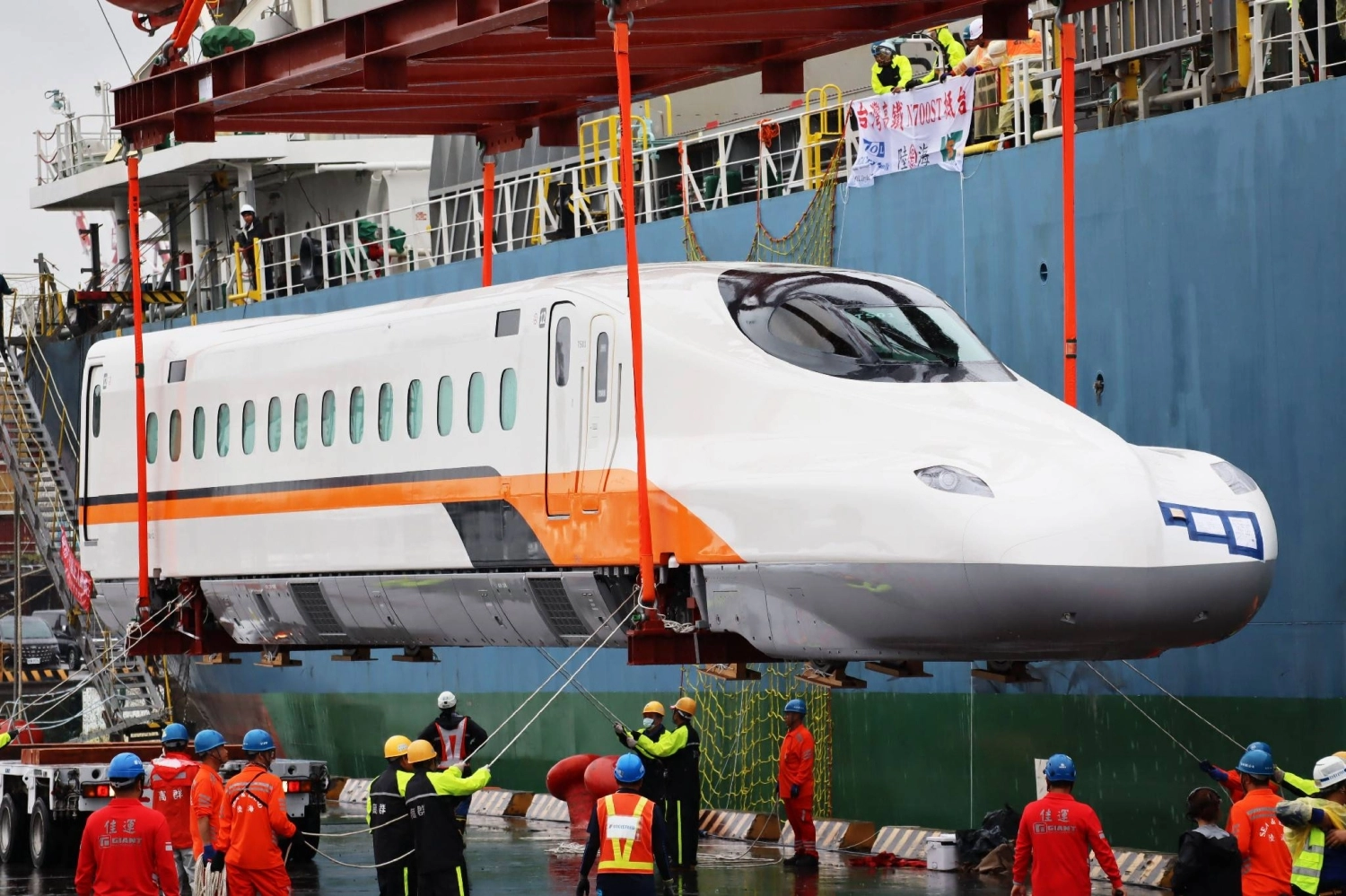 A new Taiwan High Speed Rail train car is unloaded from a cargo ship at a port in Kaohsiung, Taiwan, on Saturday.