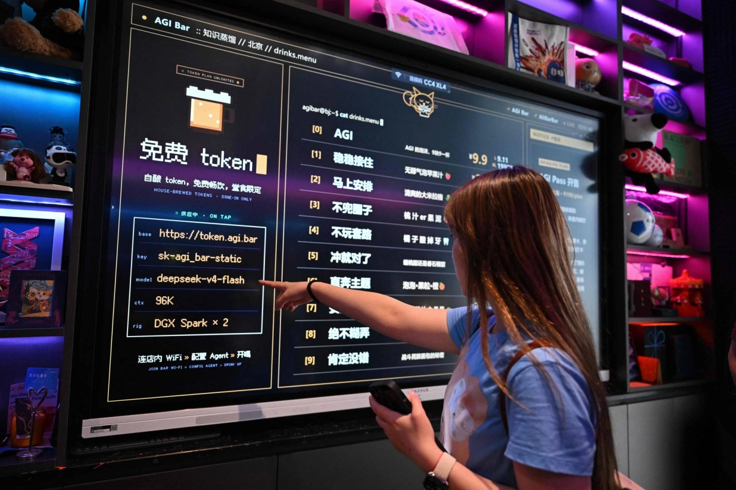 A customer looks at the menu at an AI bar in Beijing on Aug. 9, where visitors can access DeepSeek for free. Price wars in China are becoming a threat to its large-language model makers.