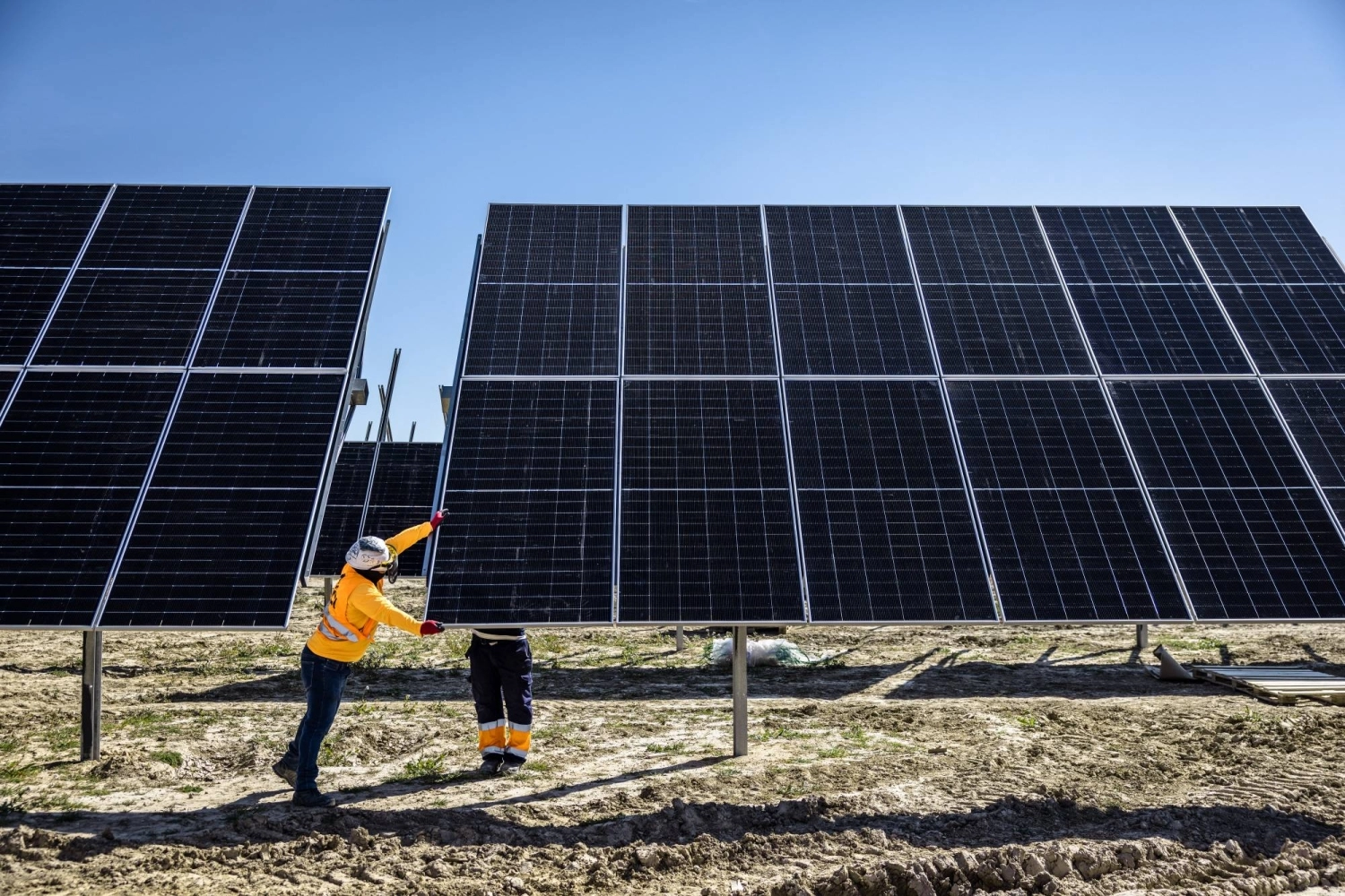 Workers install solar panels at the Fuendetodos II solar park in Villanueva de Huerva, Spain. Workers install solar panels at the Fuendetodos II solar park in Villanueva de Huerva, Spain.