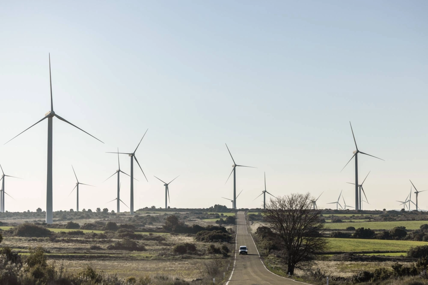 Wind turbines near Zaragoza, Spain. The country is both ahead of the clean-power curve and the fastest-growing major economy in Europe, proof that deploying green energy at massive scale isn’t at odds with growth. Wind turbines near Zaragoza, Spain. The country is both ahead of the clean-power curve and the fastest-growing major economy in Europe, proof that deploying green energy at massive scale isn’t at odds with growth.