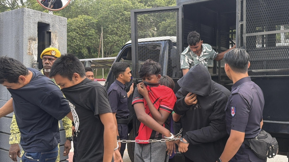 Skudai school fight: Teens and guardians face rioting charges outside SMK Taman Selesa Jaya Some of the 14 juvenile boys, aged 12 to 17, arrive at the Johor Bahru court complex to face rioting charges outside their school at the Magistrate's Court on April 14, 2026. — Picture by Ben Tan