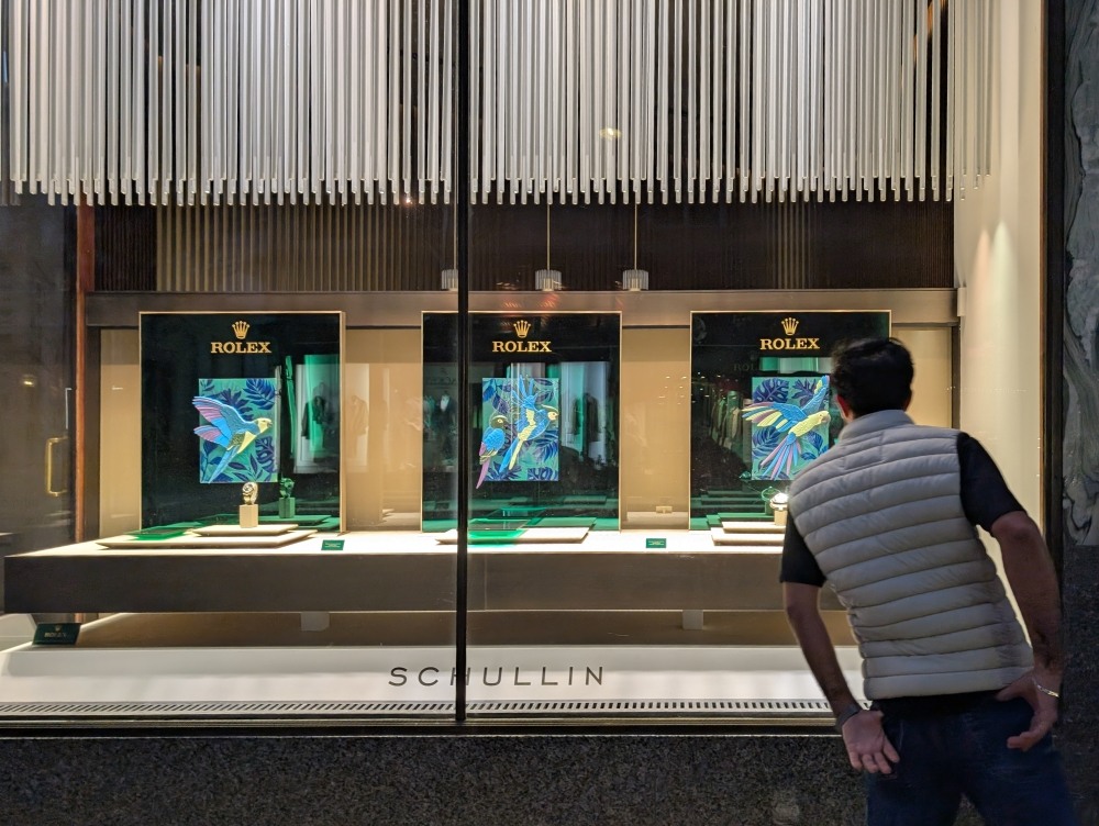 A man observes the Rolex luxury watch window display at a jeweller in Vienna, Austria on June 8, 2025. — Reuters pic