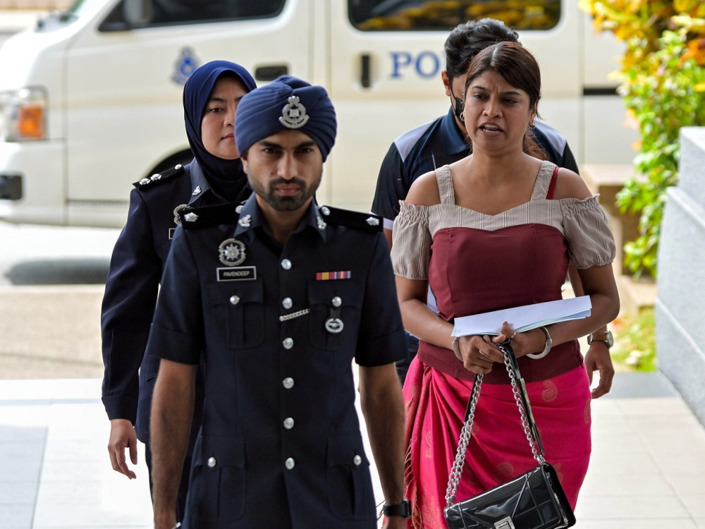 December trial date set for ‘Inspector Sheila’ after AGC rejects representation ‘Inspector Sheila’ (in red), whose real name is Sheila Sharon Steven Kumar, will stand trial in December after the Attorney General’s Chambers rejected her representation. — Bernama pic