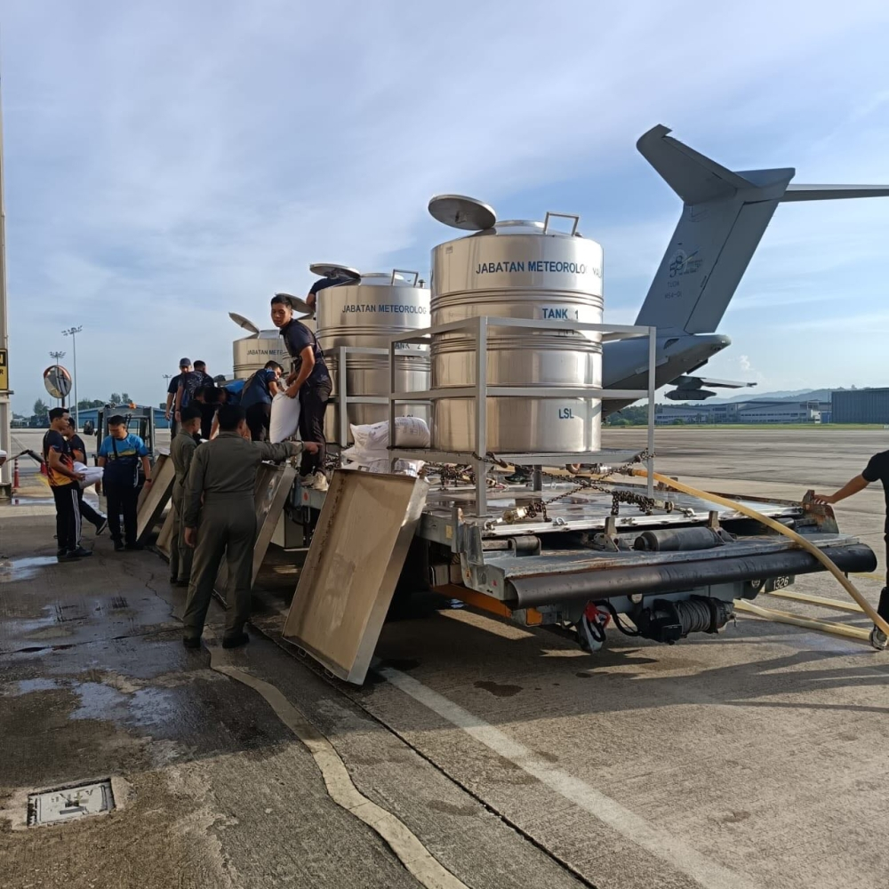 Day 1 of cloud seeding begins in Kedah and Perlis as dam water levels drop to critical stage MetMalaysia staff prepare the saltwater mixture for cloud seeding before loading the barrels onto the RMAF aircraft at the Subang airbase for operations in Perlis and Kedah on May 11, 2026. — Picture from Facebook/Agensi Pengurusan Bencana Negara, Jabatan Perdana Menteri