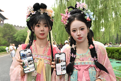 Xiaohongshu is coming for Instagram, TikTok, and your travel plans — all at once Two tourists from Jilin province show their Xiaohongshu accounts on their mobile phones as they visit the Forbidden City in Beijing on July 11, 2026. — AFP pic