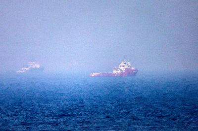 US strikes Iran for third night as Trump says deal still 'possible' This picture shows ships sailing near the Strait of Hormuz off the eastern coast of the United Arab Emirates at Khor Fakkan on July 13, 2026. The United States is