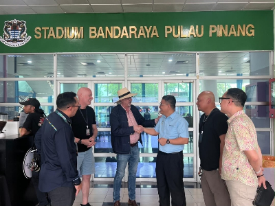 Penang courts more global productions as Mark Wahlberg filming puts state in focus Penang Tourism and Creative Economy Committee chairman Wong Hon Wai (third from right) greets ‘The Big Fix’ producer Bennett Walsh at Penang City Stadium. — Picture courtesy of Wong Hon Wai’s office