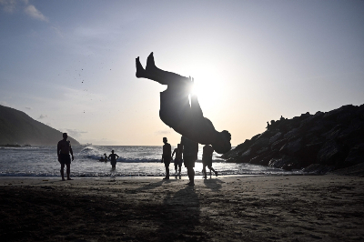 Venezuela’s ‘blessed’ town that stood untouched after deadly earthquakes Rescuers enjoy the beach at sunset during a day off in Anare, La Guaira state, on July 14, 2026. The hillside town escaped major damage from twin earthquakes that devastated parts of Venezuela’s La Guaira state, leaving more than 4,700 people dead and nearly 17,000 injured, according to an official report. — AFP pic