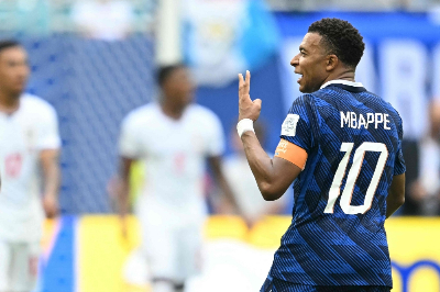 Mbappe makes World Cup history with second Golden Boot France’s Kylian Mbappe celebrates after scoring his team’s third goal in the 2026 World Cup third-place play-off against England at Miami Stadium. — AFP pic