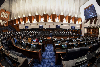 Ministers: Resign or be sacked? — Hafiz Hassan Parliament staff seen making preparations in the Dewan Rakyat on July 13, 2018. — Bernama pic