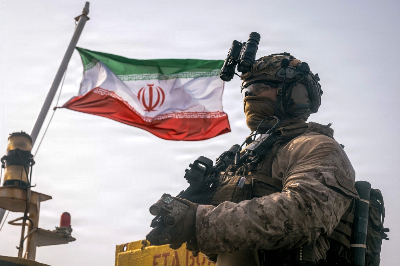 Pezeshkian warns of ‘full-scale war’ as Trump vows Iran will pay ‘many times over’ for US deaths An Iranian flag flies behind a US Marine from the 11th Marine Expeditionary Unit during a verification boarding aboard the M/T Wen Yao in the Gulf of Oman on July 16, 2026. — AFP pic