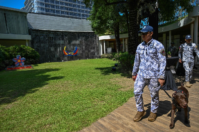 Asean ministers gather in Manila amid deep divide over Myanmar and US-Iran war Philippine Coast Guard personnel and a sniffer dog patrol the International Media Center during the 59th Asean Foreign Ministers’ Meeting in Manila on July 20, 2026. — AFP pic