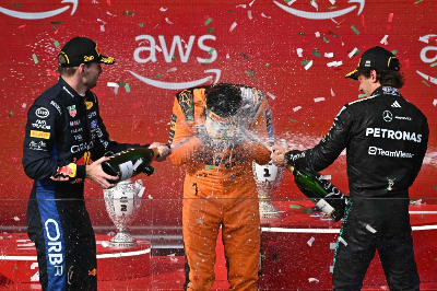 McLaren’s Norris beats Verstappen and Antonelli in Hungarian GP thriller Hungarian Grand Prix winner Lando Norris of McLaren celebrates on the podium with second-placed Max Verstappen of Red Bull Racing and third-placed Kimi Antonelli of Mercedes at the Hungaroring in Mogyoród near Budapest on July 26, 2026. — AFP pic