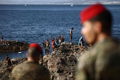 Ceuta migrant influx leaves 72 dead, officials say Members of the Spanish Army’s ‘Regulares’ infantry forces watch a group of migrants near the border post of the Spanish enclave of Ceuta August 2, 2026. — AFP pic