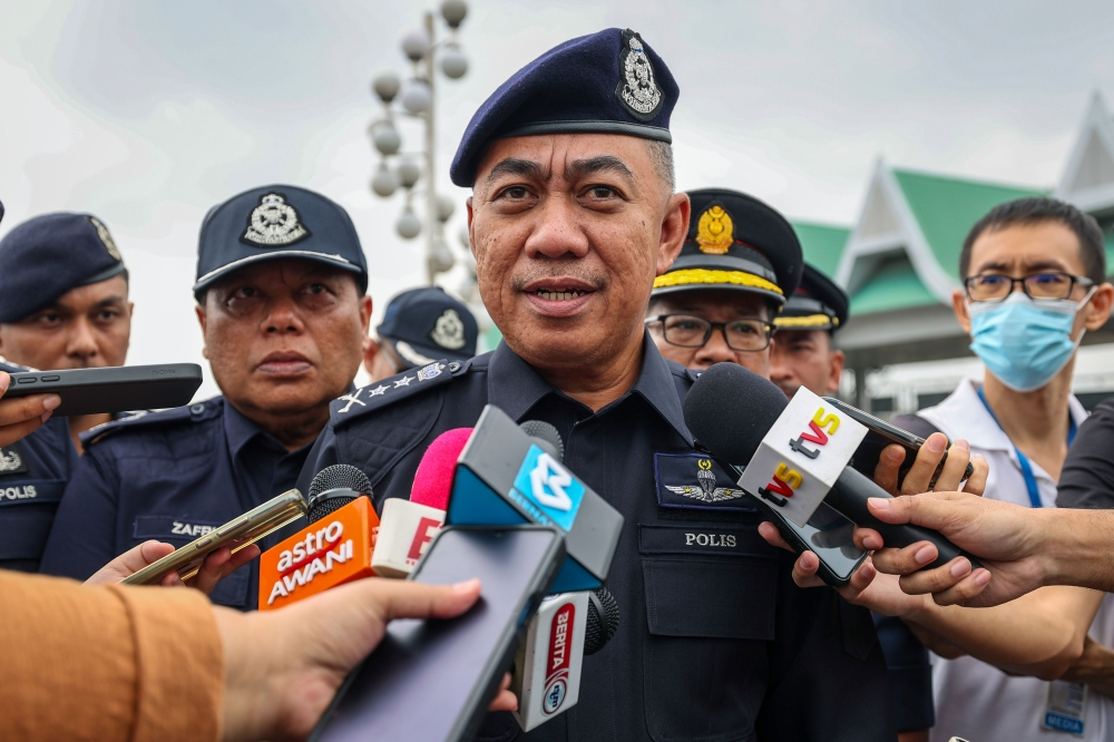 Police question 10 individuals over deaths of two teen girls in Ipoh Datuk Mohd Alwi Zainal Abidin speaks to reporters during the Penang PDRM Op Selamat 2024/2025 Advocacy Ceremony in conjunction with Hari Raya Aidilfitri at the Juru Toll Plaza on March 28, 2025. — Bernama pic