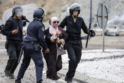 Ceuta crisis exposes the massive fault lines in EU migration policy A woman is escorted by Moroccan security forces during clashes with migrants attempting to cross into Spain’s North African enclave of Ceuta near the town of Fnideq, on the Morocco-Spain border, on July 31, 2026. — AFP pic