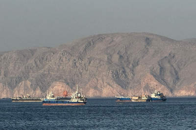 US eyes Hormuz deal ‘today or tomorrow’ as ship sinks in Red Sea Vessels are seen anchored in the Strait of Hormuz, off the port city of Khasab on Oman northern Musandam Peninsula on May 17, 2026. — AFP file pic