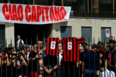 Football great Franco Baresi honoured by thousands at Milan funeral AC Milan supporters gather for the funeral of late AC Milan football player Franco Baresi in Milan on August 4. — AFP pic