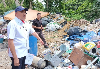 Johor sets up special team to probe claims of Singapore waste dumped in Pontian Johor Housing and Local Government Committee chairman Datuk Mohd Jafni Md Shukor pointing to solid waste during a visit to the scrap recycling premise in Kampung Maju Jaya, Kempas in Johor Bahru that was alleged to be involved in illegal open burning activities, August 11, 2026. — Picture by Ben Tan