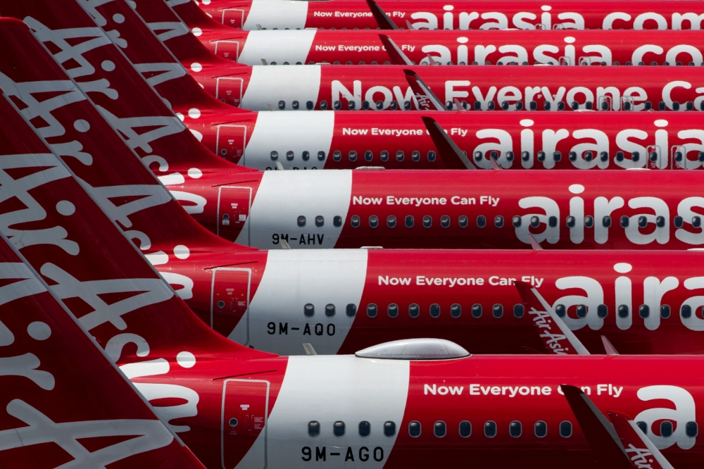 AirAsia Group cuts seats as fuel costs drive RM527m quarterly loss AirAsia is cutting its seat capacity by up to 25 per cent in Q3 2026 as soaring fuel costs contributed to a RM527.16 million net loss in the latest quarter. — AFP pic