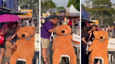 ‘Don’t give up’: Kuching festival-goers whisper messages of hope to children with cancer through giant teddy bear (VIDEO) Screengrab from the SCCS video on the social experiment shows people whispering into Joseph’s ear. — The Borneo Post pic