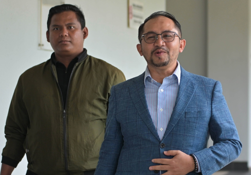 Witness: Hamzah Zainudin’s ex-aide Sayed Amir Muzzakkir asked for ‘a portion’ of the RM19m PDRM consultancy fee Former political secretary to ex-home minister Datuk Seri Hamzah Zainudin, Sayed Amir Muzzakkir Al Sayed Mohamad (right), is seen at the Sessions Court in Kuala Lumpur on January 12, 2026. — Bernama pic