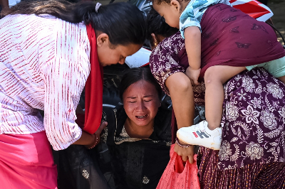 Nepal flood death toll climbs to 389 as rescue teams search for missing A woman breaks down as she waits for relatives at an army camp after being rescued from flood-hit areas in Battar Bazar, Nepal’s Nuwakot district, on August 27, 2026. — AFP pic