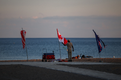 Trump’s latest map makeover: Lake Ontario becomes ‘Lake America’, Canada says no A man stands beside a Canadian flag at Lake Ontario in Toronto, Ontario, on August 27, 2026, after US President Donald Trump ordered the lake renamed ‘Lake America’ amid a spiralling trade war with Canada. — AFP pic